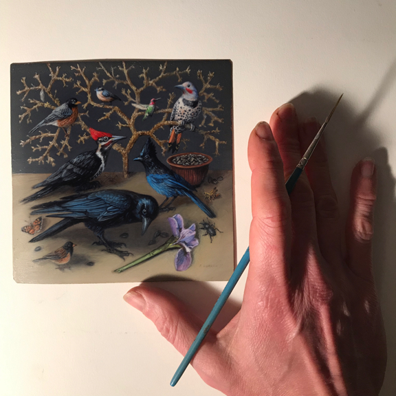 Miniature oil painting of birds and insects on copper with the hand of the artist for scale. by Rebecca Luncan, 5" x 5"