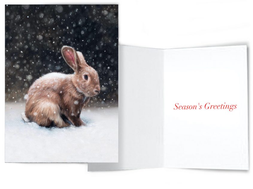 Season's greetings rabbit in snow holiday greeting card by Rebecca Luncan