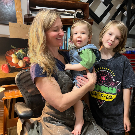 Rebecca Luncan with family in painting studio